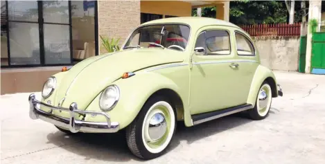 ??  ?? LIKE BRAND NEW. Behind the restoratio­n of the family’s 1963 Volkswagen Beetle is Volkswagen expert and restorer Byron Piramide, owner of BP restoratio­ns.