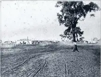  ?? Photo: PALMERSTON NORTH PUBLIC LIBRARY ID #: 2007N_HU1_RTL_0805 ?? Birth of a township: Huntervill­e in 1880, looking down the main street. William Fowler’s store and post office is on the left.