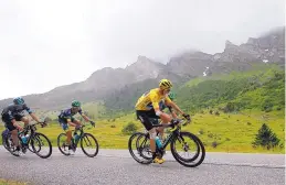  ?? PETER DEJONG/ASSOCIATED PRESS ?? Britain’s Chris Froome, wearing the jellow jersey, rides during Saturday’s 20th stage of the Tour de France.