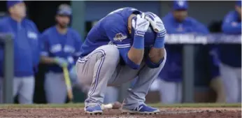  ?? CHARLIE RIEDEL/THE ASSOCIATED PRESS ?? Toronto Blue Jays’ Jose Bautista reacts after striking out against the Kansas City Royals during Game 2.
