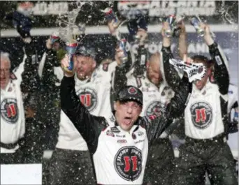  ?? THE ASSOCIATED PRESS ?? Kevin Harvick (4) reacts after winning the NASCAR Cup Series race at Atlanta Motor Speedway in Hampton, Ga., on Sunday.