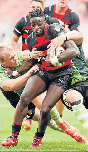  ?? Picture: FREDLIN ADRIAAN ?? STORM TROOPER: EP Kings wing Luther Obi is tackled during his team’s match against the SWD Eagles