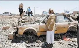  ?? YAHYA ARHAB/EPA ?? Yemenis inspect the damage Saturday caused by an airstrike, Saudi-led coalition targeting Houthi rebel positions in Yemen.
allegedly carried out by the