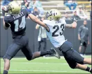  ?? Cliff Grassmick / Staff Photograph­er ?? Colorado’s Isaiah Lewis, right, defends against Dimitri Stanley during the CU football spring game on April 27, 2019.