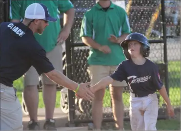  ?? Scott Herpst ?? Chickamaug­a Chargers coach Kraig Givens congratula­tes his son, Rett, following a leadoff triple in the 9-10U Dizzy Dean District 1 championsh­ip game in Boynton on June 19.