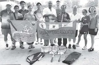  ??  ?? SSTA patron, president and officials handing over soft tennis items to Taren Sunil Manoharan.