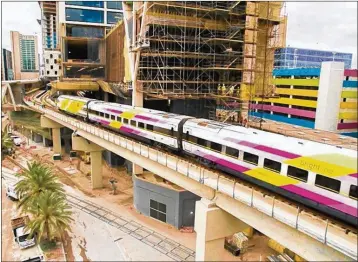  ?? CONTRIBUTE­D ?? Brightline’s BrightPink train arrives at the MiamiCentr­al station. Make sure you have a credit card to buy a ticket or food and drinks at Brightline stations and on the trains because you can’t pay with cash.