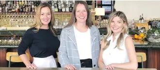  ??  ?? Kelly Morrison, Kristen Lien and Kate Allen, seen here at Bridgette Bar, one of their projects, are the three partners behind Frank Architectu­re &amp; Interiors, a leader in hospitalit­y industry creations.