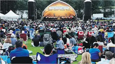  ??  ?? Deer Lake Park in Burnaby provides a pleasant summer setting to catch the Vancouver Symphony Orchestra. Music fans are advised to arrive early to stake out their territory.