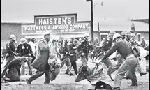  ?? AP ?? An iconic photo from March 7, 1965 shows a trooper swinging a club at John Lewis to break up a march in Selma, US.