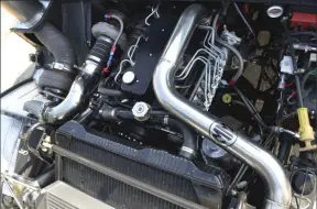  ??  ??  Performing a Cummins swap is hard enough, but Steve Ortner went the extra mile and built his 5.9L 12-valve for monster power. The engine pushes an estimated 1,000 hp and 1,700 lb-ft of torque through a J&amp;H 4L80 to the Hummer’s all-wheel-drive system.