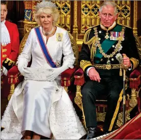  ?? ?? REGAL RUCKUS: Charles and Camilla at Parliament’s state opening in 2015 and, left, the newborn Prince with his mother, then Princess Elizabeth, in 1948