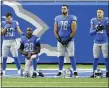  ?? DUANE BURLESON — THE ASSOCIATED PRESS ?? Detroit Lions offensive guard Oday Aboushi (76), stands with wide receiver Danny Amendola (80), running back Adrian Peterson (28) and safety Miles Killebrew (35) during the national anthem before Sunday’s game in Detroit.
