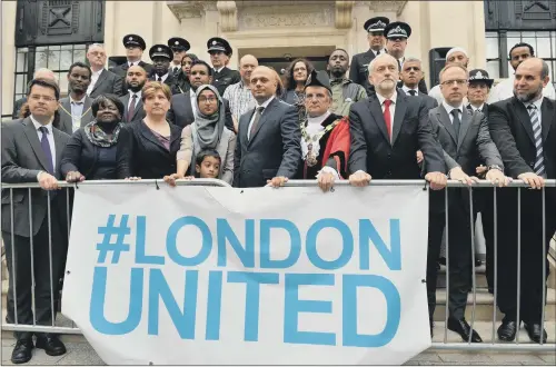  ?? PICTURE: DOMINIC LIPINSKI/PA WIRE. ?? MESSAGE: Politician­s and police services outside Islington Town Hall in London after attending a service to mark the one-year anniversar­y of the attack.