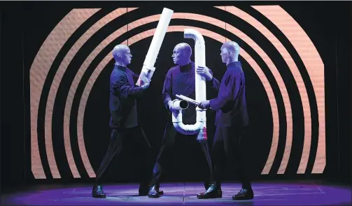  ?? PHOTOS PROVIDED TO CHINA DAILY ?? Three blue men drum on PVC tubes during the dressed rehearsal for Blue Man Group’s debut show in the Guangzhou Opera House.