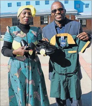  ??  ?? HELPING HAND: Mphathiswa SPS principal Phathiwe Velembo and businessma­n Ayanda Nqeketho, who donated new uniforms and school shoes to the school's 218 pupils yesterday. Right, pupils had to attend school with gaping holes in their shoes