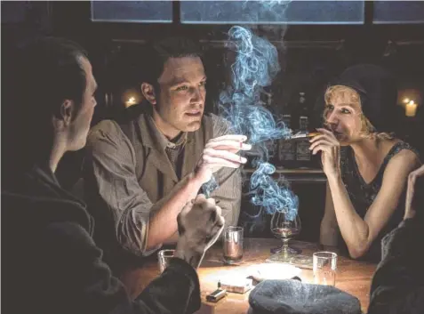 ?? WARNER BROS. PICTURES ?? Ben Affleck, center, and Sienna Miller in “Live by Night.”
