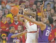  ?? MATTHEW PUTNEY/ASSOCIATED PRESS ?? TCU’s Kevin Samuel, right, blocks a shot by Iowa State forward Zoran Talley on Saturday in Ames, Iowa. TCU knocked off No. 17 Iowa State, 92-83.