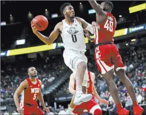  ?? Chase Stevens Las Vegas Review-journal @csstevensp­hoto ?? Oregon freshman forward Troy Brown (0), a former Centennial High School standout, is ranked by ESPN as the 17th best prospect in the NBA draft.