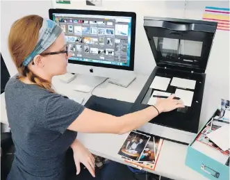  ??  ?? Specialist Erin McClintic works in the lab at Phototroni­cs in Winnetka, Illinois, digitizing and archiving a shoebox of customer photograph­s, right.