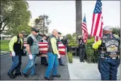  ?? SARAH REINGEWIRT­Z STAFF PHOTOGRAPH­ER ?? The remains of 1st Lt. Ernest L. Roth, a pilot who was killed in World War II, are carried by members of the Patriot Guard Riders into Pierce Brothers Mortuary in Westwood Village on Wednesday.