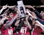  ?? AP/FRANK FRANKLIN II ?? Members of the South Carolina men’s basketball team hold up the East Regional championsh­ip trophy after the Gamecocks advanced to their first Final Four by beating Florida last weekend. The Palmetto State has enjoyed a great deal of success over the...