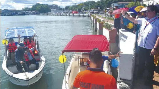  ?? JOSELITO VILLASIS/PN ?? The Iloilo City government launches the Iloilo- Batiano River Patrol, an inter-agency collaborat­ion, to monitor the Iloilo River and Batiano River. According to Mayor Jed Patrick Mabilog (right), there is a need to monitor, among others, the water...