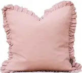  ?? ?? Oli ruffle pink linen cushion, £47, The French Bedroom Company
Providing you have a bed large enough, stacks of stonewashe­d linen cushions pull everything together.