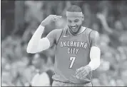  ?? SUE OGROCKI — THE ASSOCIATED PRESS ?? Carmelo Anthony had a reason to smile after hitting a 3-pointer against his former team as the Thunder opened with a win over the Knicks on Thursday.