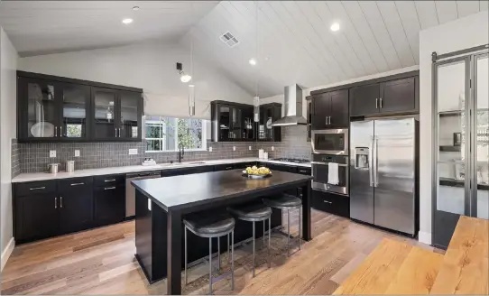  ?? ?? This is the kitchen at the Haystacks model home at Trio.