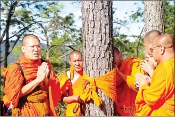  ?? SUPPLIED ?? Venerable Yorn Seng Yeat (left) leads monks on a trip to forests spanning Kampong Speu and Koh Kong provinces in November last year.