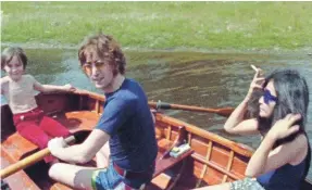  ?? FROM THE 1971 FILM “IMAGINE” VIA YOKO ONO LENNON ?? John and Yoko with John’s son Julian on the lake at Tittenhurs­t Park, their English country home, in July 1971.
