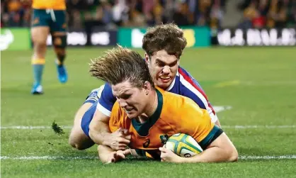  ?? Photograph: Daniel Pockett/Getty Images ?? Michael Hooper scores a try but it was not enough for the Wallabies to avoid defeat to France in the second Test.