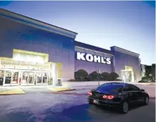  ?? AP PHOTO/JOHN RAOUX ?? A car drives by the entrance of a Kohl’s department store in Orlando, Fla. Nordstrom’s new service hubs in Los Angeles and Manhattan are allowing shoppers to return online orders from any retailer. In July, Kohl’s rolled out its partnershi­p with Amazon to all of its 1,100 store locations.