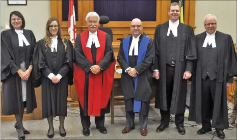  ?? Photo by Matthew Liebenberg ?? Two lawyers were called to the bar in Swift Current, Sept. 21. They are pictured after the ceremony with local judges and the lawyers who introduced them. From left to right, Andrea Argue, Ashley Falk, Justice T.J. Keene, Judge K.P. Bazin, Jean Jordaan, and Neil Gibbings.