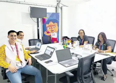  ?? CONTRIBUTE­D ?? From left: Parapan Games volunteers Ivan Ugaz and Augusto Alvarez Calderan, Team Jamaica chef de mission Leonie Phinn, and administra­tive personnel Ann Marie Smith in their environs at the games in Lima, Peru.