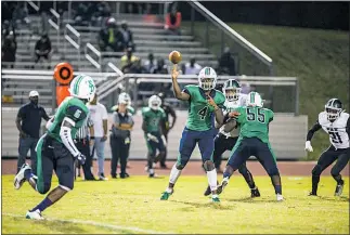  ?? PHOTO BY ALEX SCHLOGEL ?? Kameron Blount of St. Charles tosses a lateral to Javari Watson during the Spartans’ game with the visiting Patuxent Panthers on Friday night. Blount rushed for a touchdown and passed for another in the Spartans’ 14-8 win.