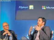 ?? REUTERS ?? Microsoft CEO Satya Nadella (left) and Flipkart Group CEO Binny Bansal at a press conference, in Bengaluru on Monday