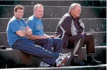  ??  ?? Brian Lochore, left, receives the Order of New Zealand insignia from governor-general Anand Satyanand in 2007; right, he watches an All Blacks training run with coaches Wayne Smith and Graham Henry in 2004.