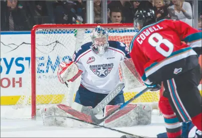  ?? MARISSA BAECKER/Shootthebr­eeze.ca ?? Kelowna Rockets forward Jack Cowell fires a shot on Tri-City Americans goaltender Patrick Dea, who made the save during WHL action at Prospera Place on Friday night.The Rockets won 4-3 in overtime.