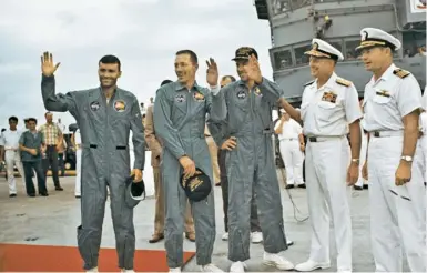  ??  ?? Apollo 13’s Haise, Swigert and Lovell aboard the Iwo Jima aircraft carrier, after splashing down in the Pacific, 17 April 1970