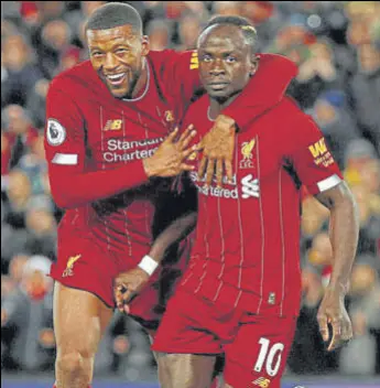  ?? REUTERS ?? Liverpool's Sadio Mane (right) celebrates his goal with Georginio Wijnaldum during Monday’s win over West Ham at Anfield.