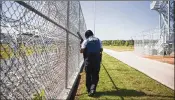  ?? NEW YORK TIMES 2015 ?? A South Carolina Department of Correction­s officer patrols outside of Lee Correction­al Institutio­n in Bishopvill­e, S.C. Seven inmates were killed and 17 others were injured in a riot at the prison Sunday.