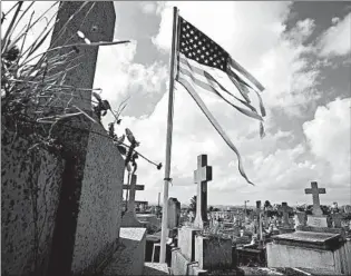  ?? CAROLYN COLE/LOS ANGELES TIMES ?? A cemetery in San Juan, Puerto Rico. President Donald Trump insists the hurricane death toll was inflated.