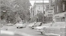  ?? CONTRIBUTE­D BY GROWING UP IN ATHENS GA FACEBOOK PAGE ?? In this circa 1960 view, the Varsity’s downtown Athens restaurant is seen directly across from the famed University of Georgia arch.