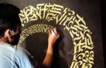  ??  ?? This photo shows artist Taipan Lucero doing calligraph­y using the indigenous script known as Baybayin, used before Spanish colonizati­on in 1521, at an event in Manila.