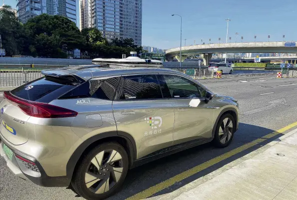  ?? PHOTOS: REUTERS ?? New tech . . . A car with autonomous driving system by Alibababac­ked DeepRoute is driven in a street in Shenzhen, China.