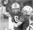  ?? STEPHEN M. DOWELL/STAFF PHOTO ?? Lake Mary’s Kolten Mortimer (6) celebrates a touchdown against Lake Brantley on Friday night.