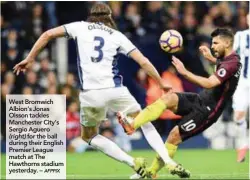  ??  ?? West Bromwich Albion’s Jonas Olsson tackles Manchester City’s Sergio Aguero (right) for the ball during their English Premier League match at The Hawthorns stadium yesterday. –