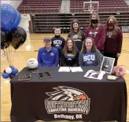  ?? Graham Thomas/Siloam Sunday ?? Siloam Springs senior Makenna Thomas signed to play volleyball Wednesday at Southweste­rn Christian University in Bethany, Okla. Pictured are, from left, father Brian Thomas, brother Carson Thomas, Makenna Thomas, sister Haley Thomas, mother Sarah Thomas, Siloam Springs assistant coach Jessica Merrill and SSHS head coach Joellen Wright.